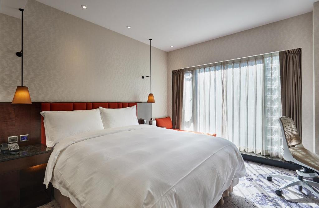 Postel nebo postele na pokoji v ubytování Tango Inn Taipei ZhongShan