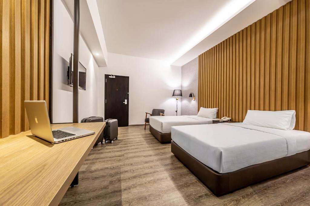 Postel nebo postele na pokoji v ubytování Thy Executive Hotel