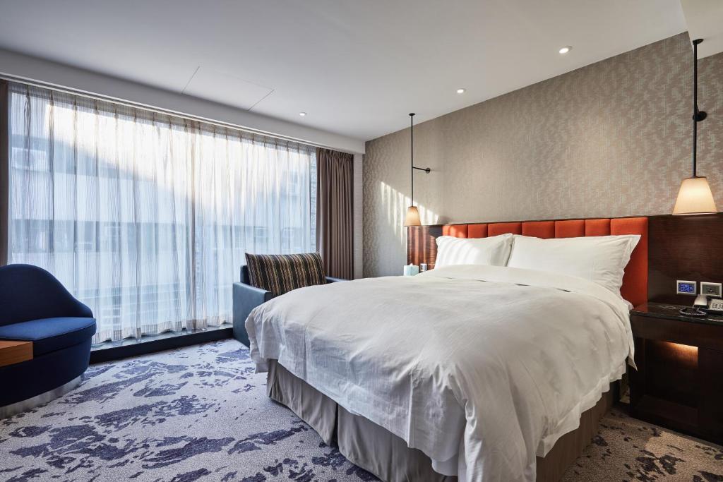 Postel nebo postele na pokoji v ubytování Tango Inn Taipei ZhongShan
