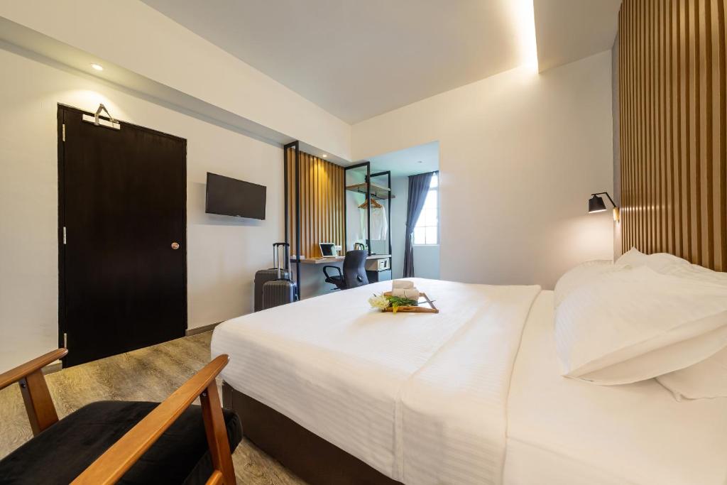 Postel nebo postele na pokoji v ubytování Thy Executive Hotel