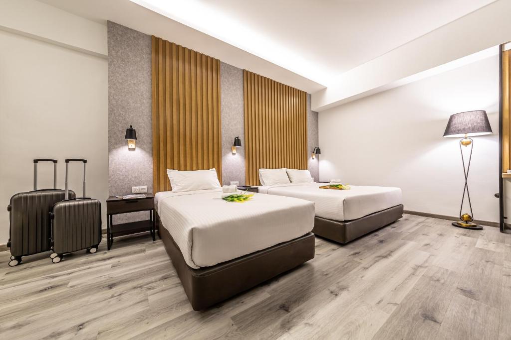 Postel nebo postele na pokoji v ubytování Thy Executive Hotel