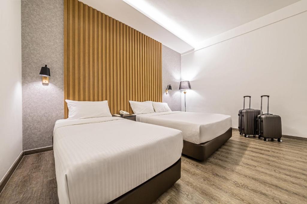 Postel nebo postele na pokoji v ubytování Thy Executive Hotel