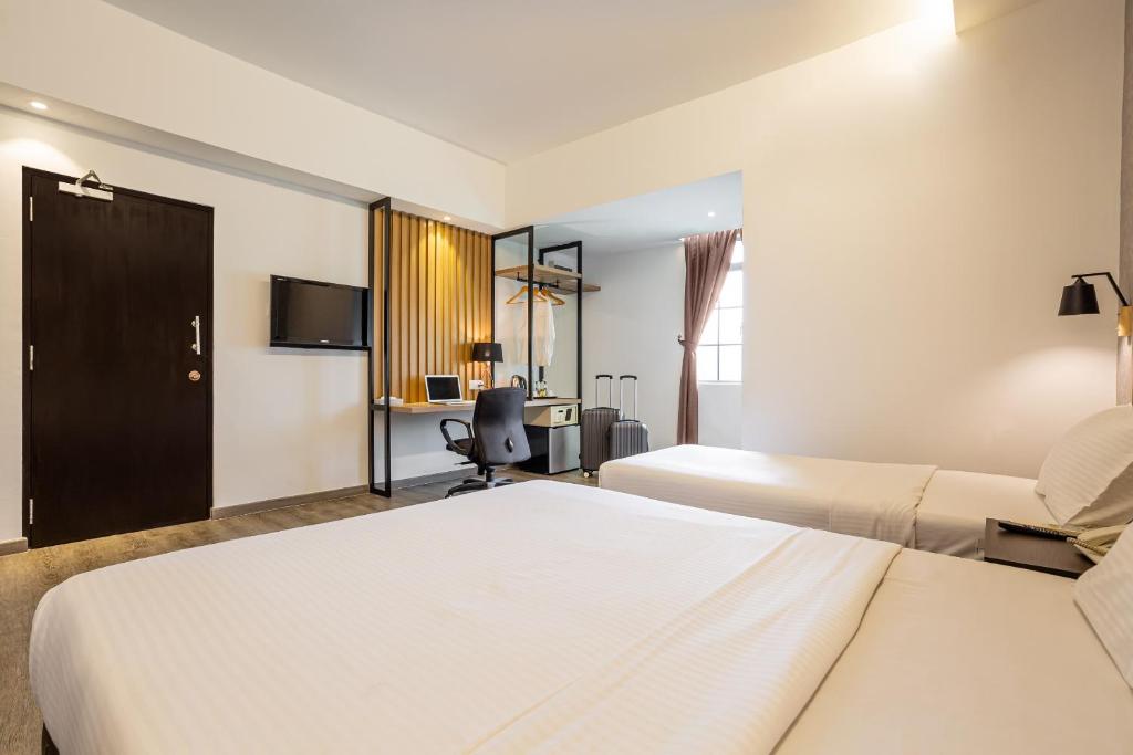 Postel nebo postele na pokoji v ubytování Thy Executive Hotel