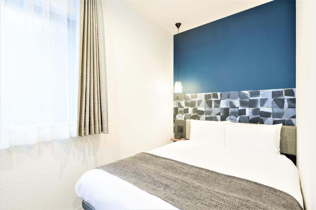 Postel nebo postele na pokoji v ubytování M's Hotel Sanjo Wakoku