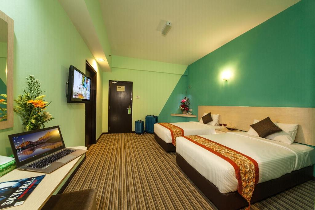 Postel nebo postele na pokoji v ubytování Thy Executive Hotel