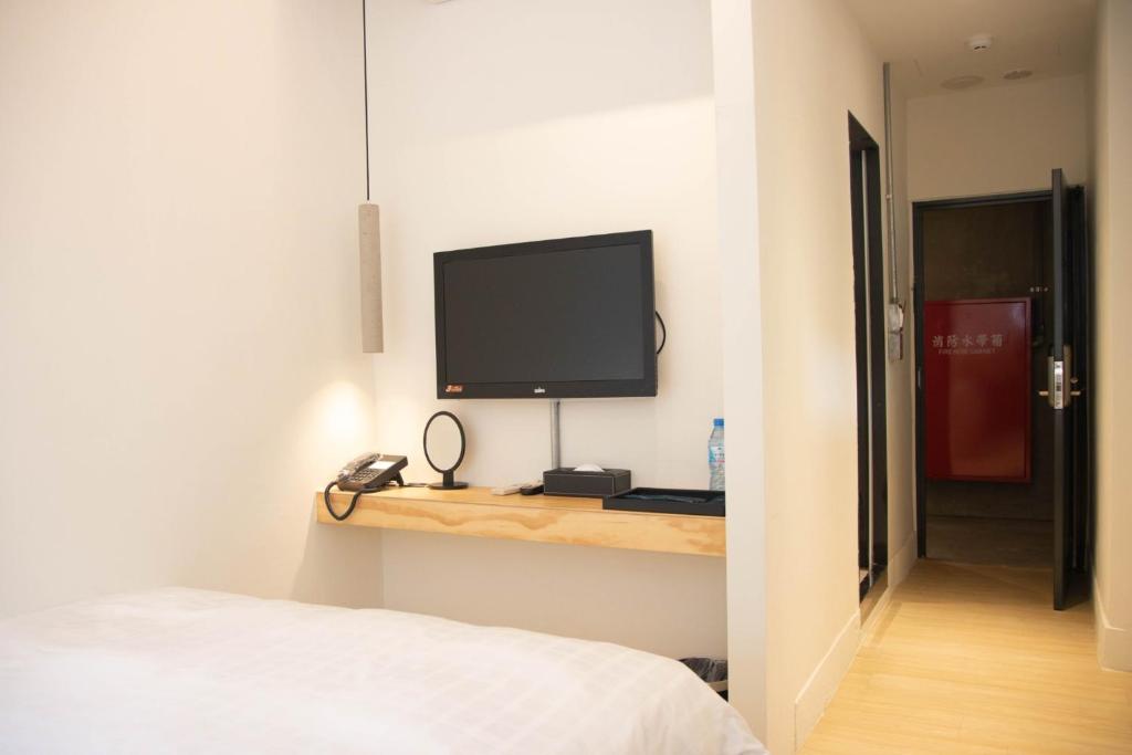 TV a/nebo společenská místnost v ubytování Home Rest Hotel 2