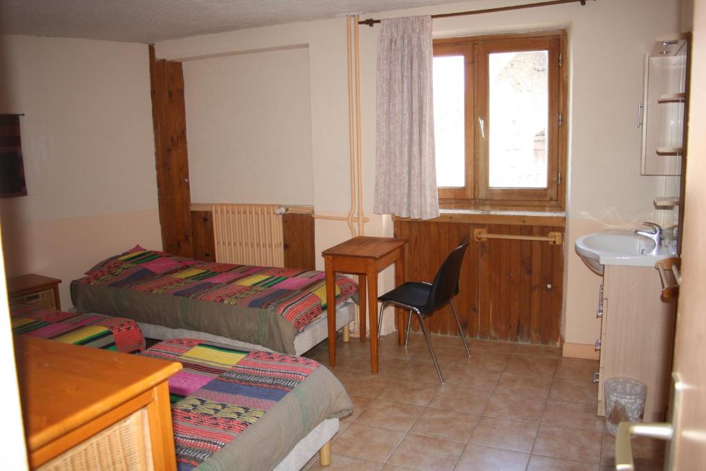 Postel nebo postele na pokoji v ubytování LE GÎTE LES MELEZES