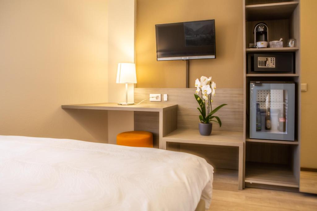 Postel nebo postele na pokoji v ubytování Hotel Unione