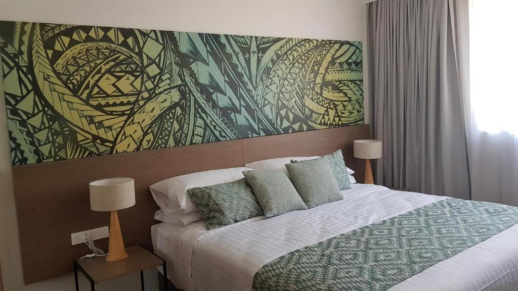 Postel nebo postele na pokoji v ubytování Lava Hotel