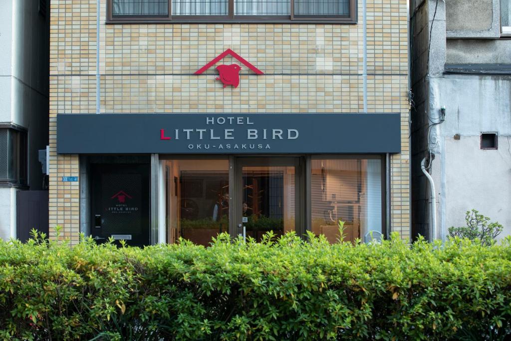 a store front with a sign for a hotel little bird at Hotel Litlle Bird OKU-ASAKUSA in Tokyo