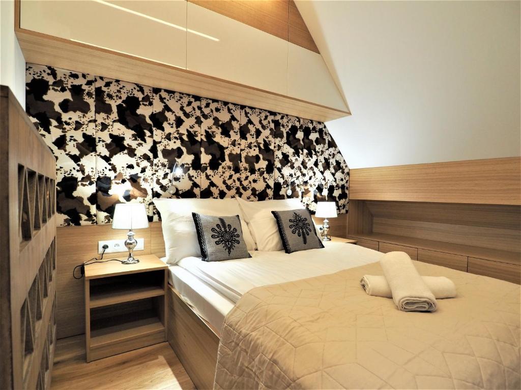 Posteľ alebo postele v izbe v ubytovaní VIP Apartamenty ROYAL SPA