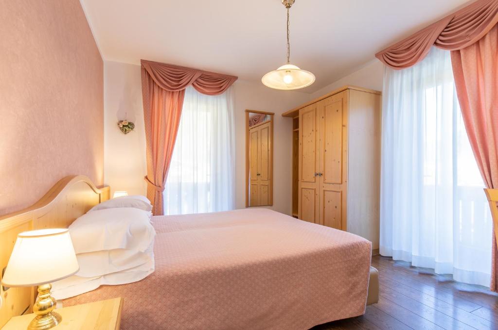 Postel nebo postele na pokoji v ubytování Albergo Conca Verde