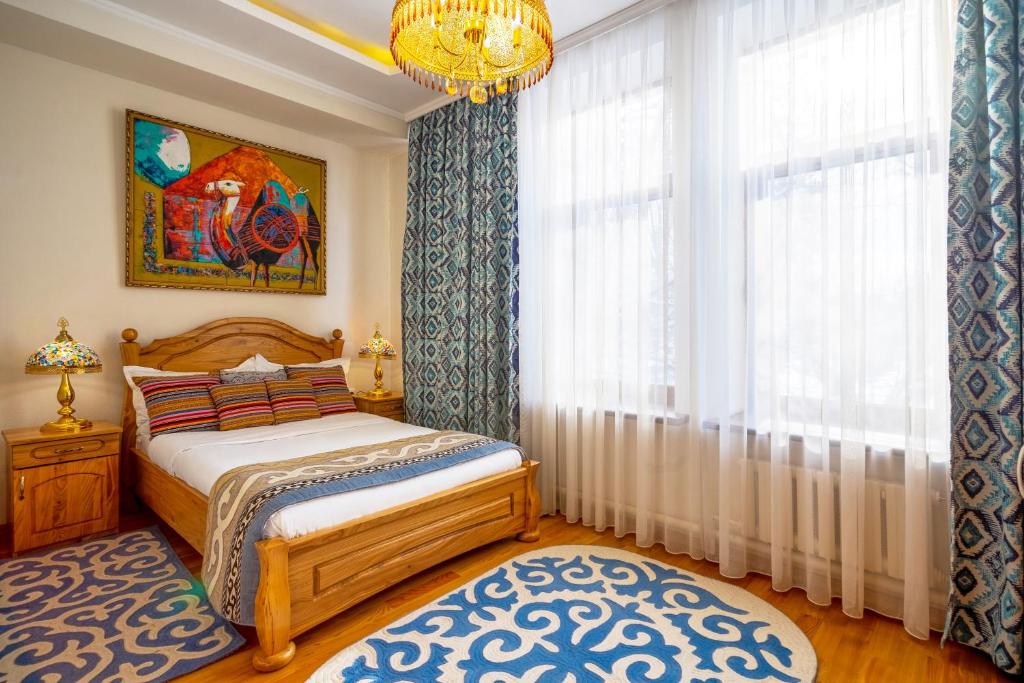 Postel nebo postele na pokoji v ubytování Navat Hotel
