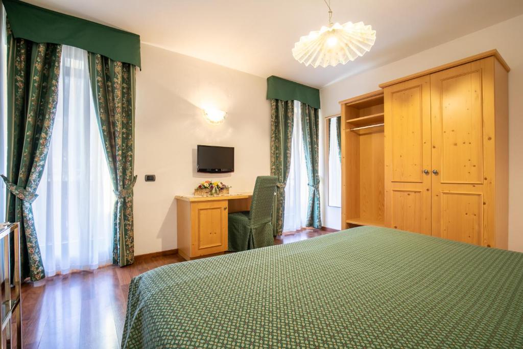 Postel nebo postele na pokoji v ubytování Albergo Conca Verde
