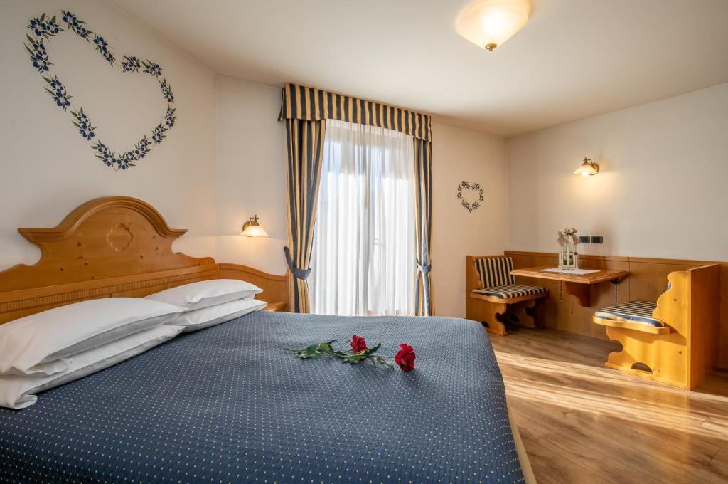 Postel nebo postele na pokoji v ubytování Albergo Conca Verde