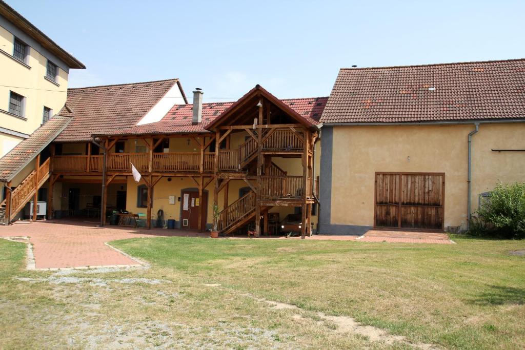 a large house with wooden floors and a yard at mlyn-osvracin in Osvračín