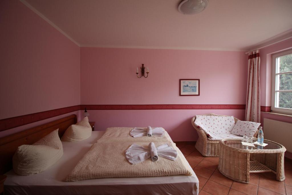 Postel nebo postele na pokoji v ubytování Landhaus Alt Reddevitz