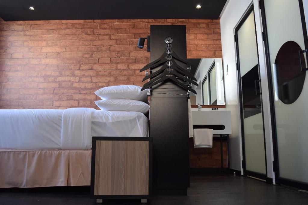 Postel nebo postele na pokoji v ubytování ONOMO Hotel Maputo