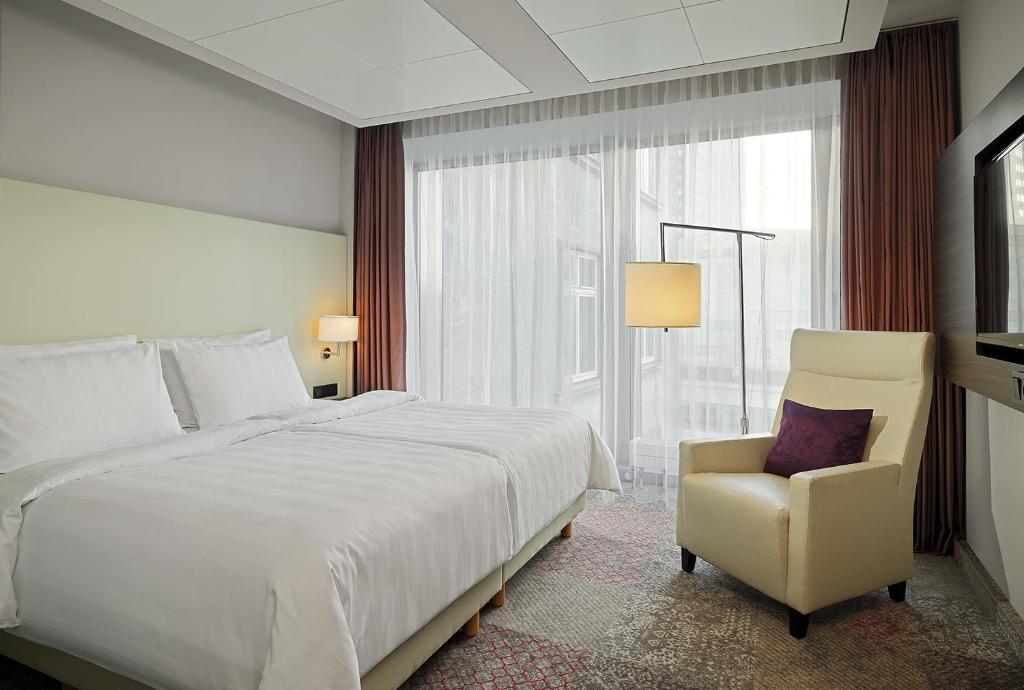 Postel nebo postele na pokoji v ubytování Radisson Blu Hotel Leipzig