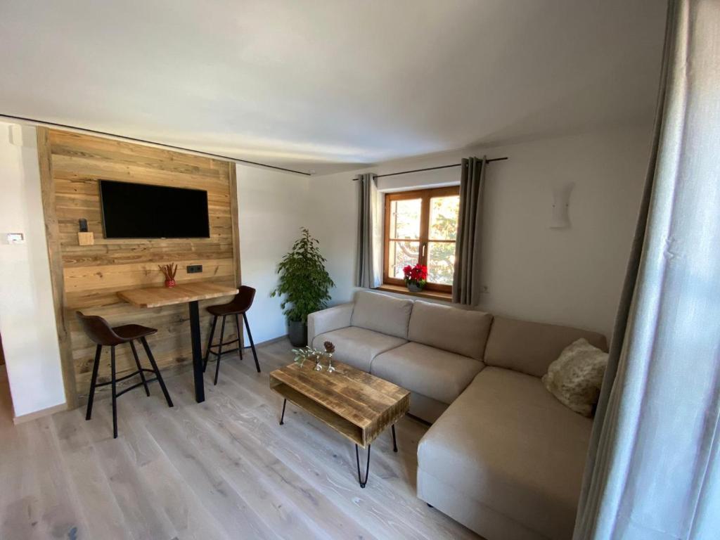 a living room with a couch and a table at Haus Ingrid in Kitzbühel