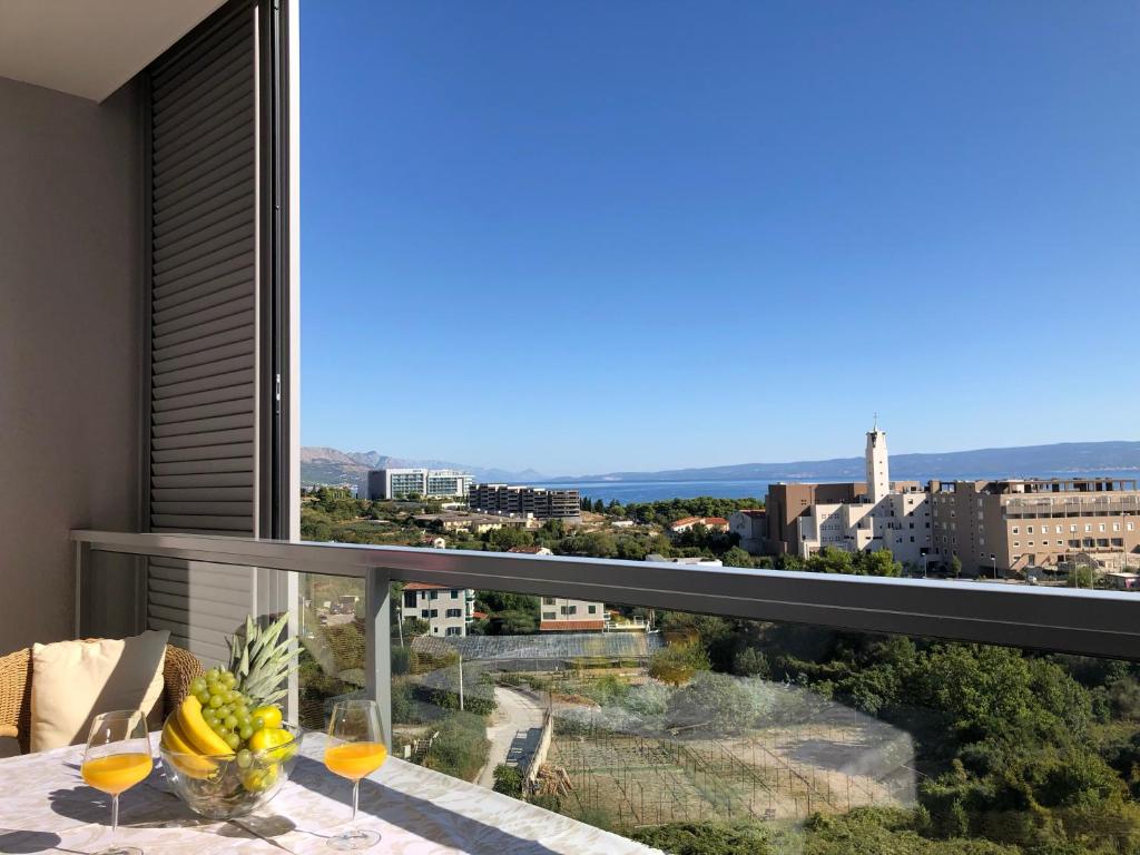 a balcony with a table with bananas on it at Apartment Charming in Split