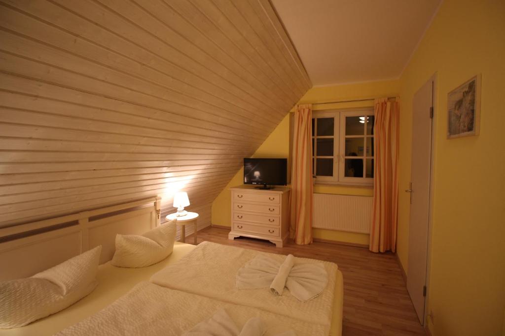 Postel nebo postele na pokoji v ubytování Landhaus Alt Reddevitz