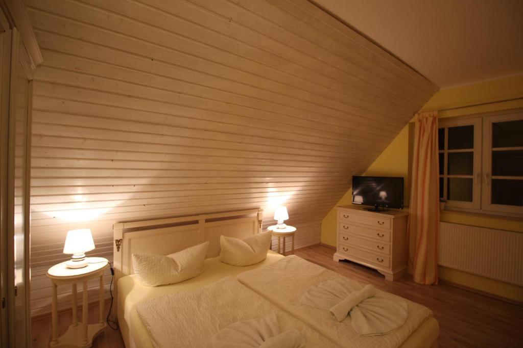 Postel nebo postele na pokoji v ubytování Landhaus Alt Reddevitz