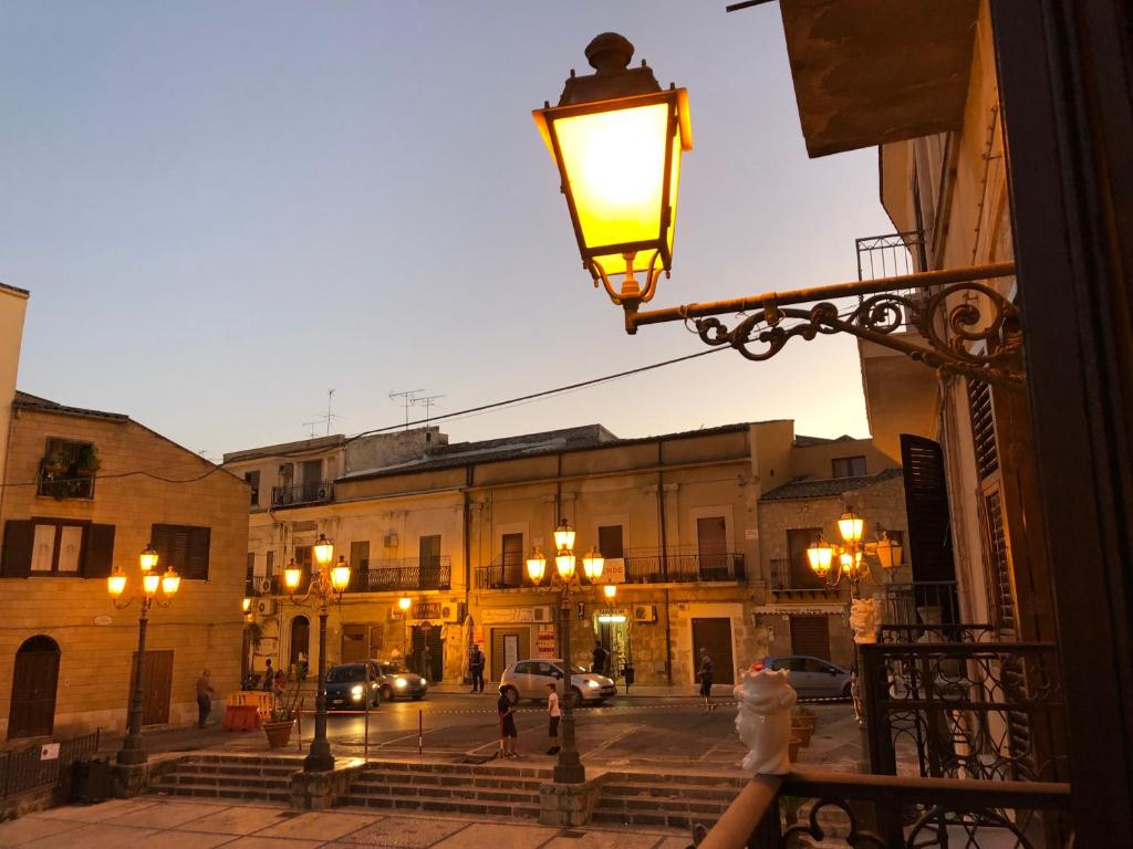 a street light on a building in a city at Cortile Umberto in Racalmuto