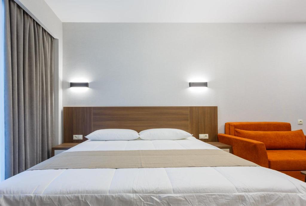 מיטה או מיטות בחדר ב-Crystal Residence 530 & 531