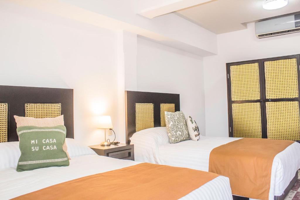 Postel nebo postele na pokoji v ubytování Múcara hotel