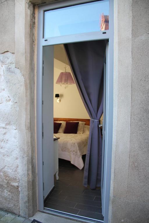 Postel nebo postele na pokoji v ubytování Château Besson