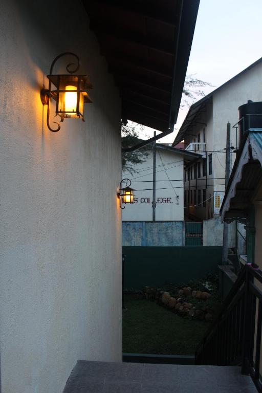 a light fixture on the side of a building at Grace in Nuwara Eliya