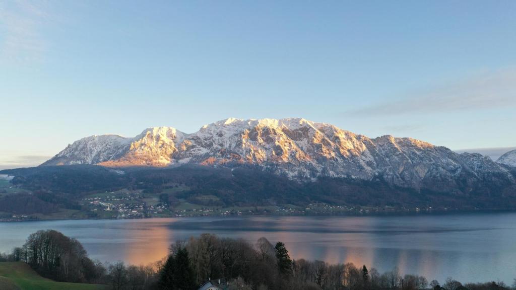 a view of a mountain in the middle of a lake at Ferienwohnung Grubinger in Unterach am Attersee