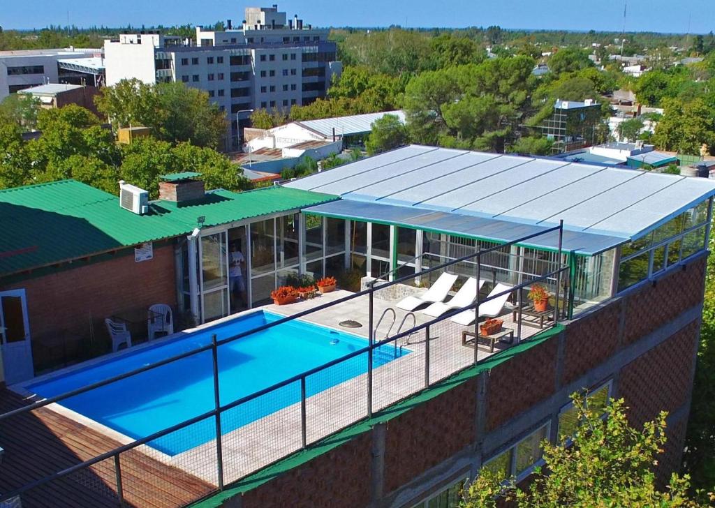 an overhead view of a building with a swimming pool at Plaza Milenium in San Rafael