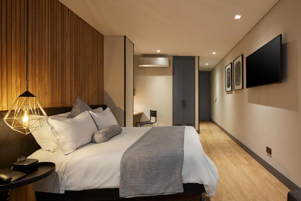 TV a/nebo společenská místnost v ubytování 14 Urban Hotel