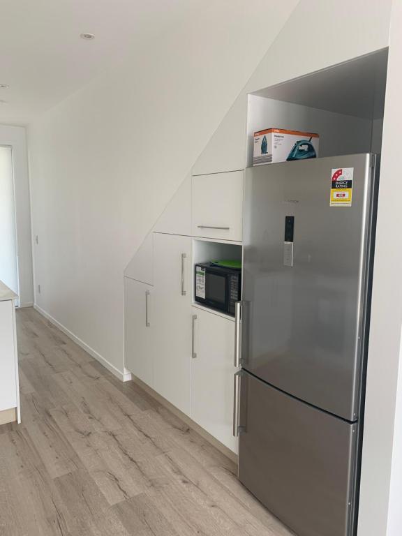Kuchyň nebo kuchyňský kout v ubytování De la Plage Residences