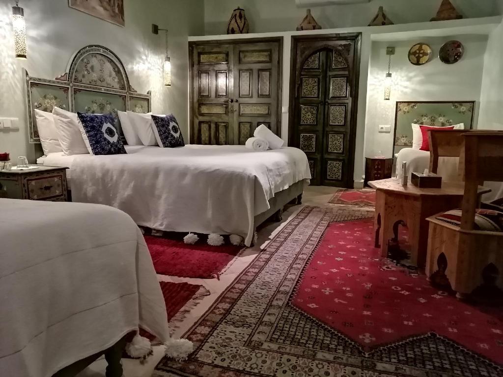 Postel nebo postele na pokoji v ubytování Riad Dalla Santa