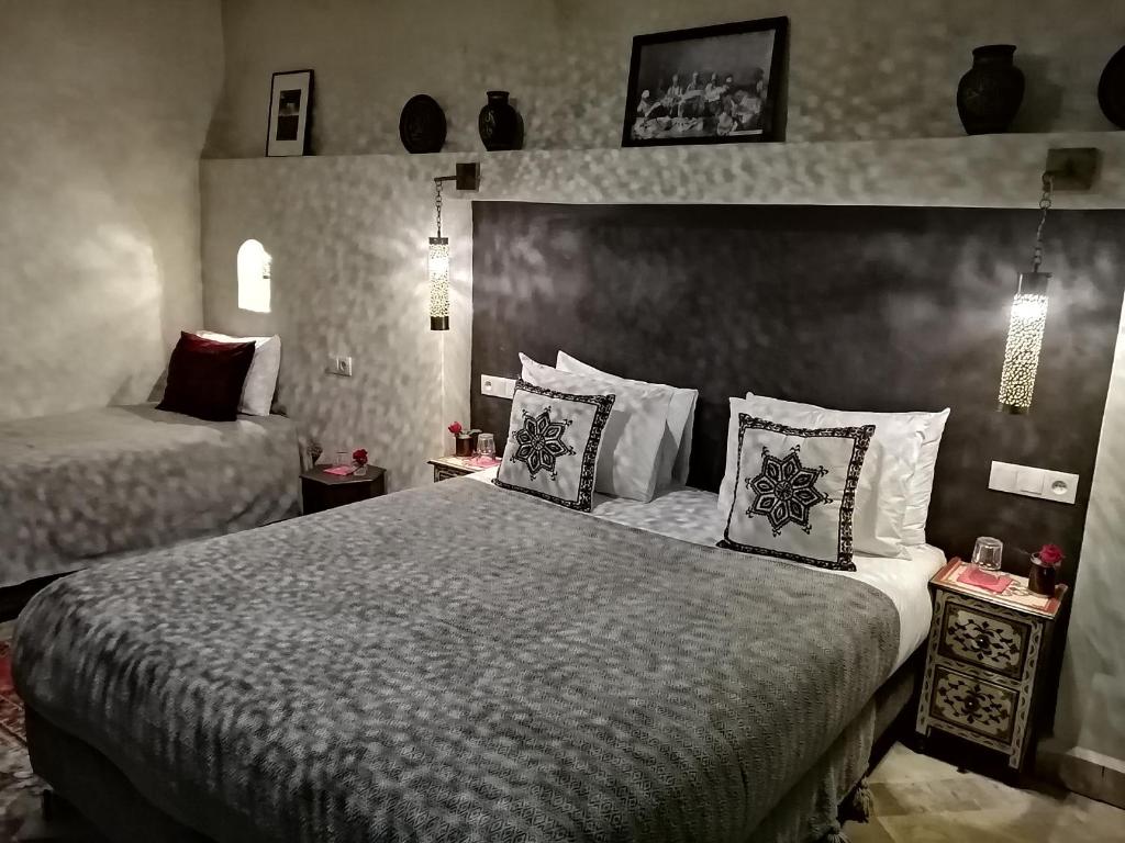 Postel nebo postele na pokoji v ubytování Riad Dalla Santa