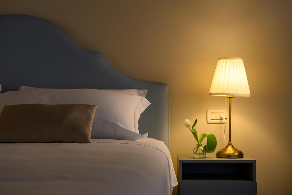 Posteľ alebo postele v izbe v ubytovaní Hotel Dorè