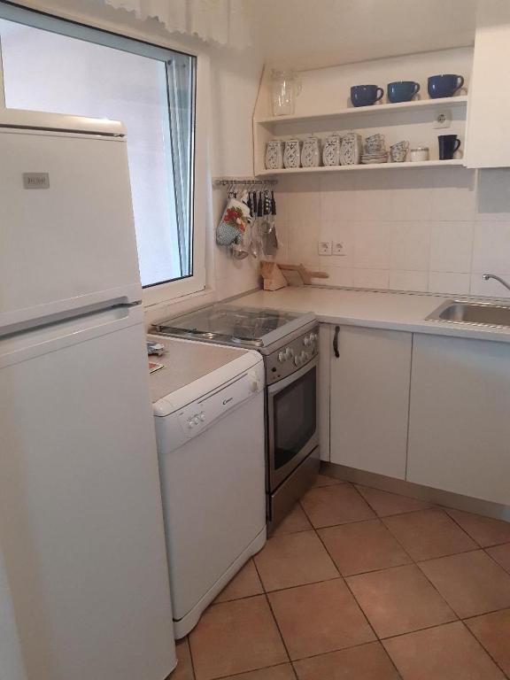 Kuchyňa alebo kuchynka v ubytovaní Apartments Škerlep