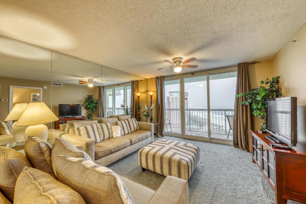 a living room with a couch and a television at The Resorts Of Pelican Beach 1413 Destin (Condo) in Destin