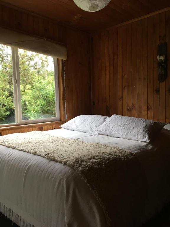 Postel nebo postele na pokoji v ubytování Bosque Patagonico Cabañas y Camping