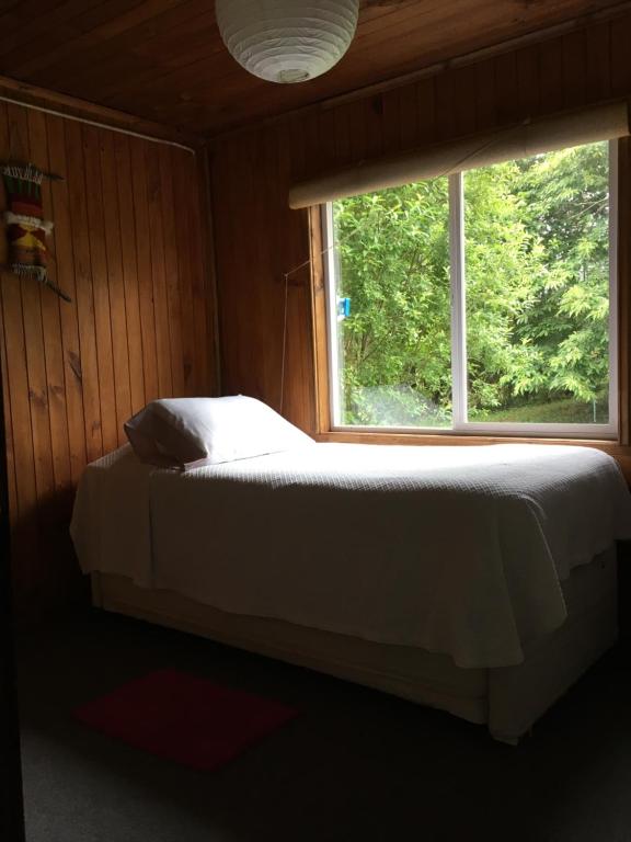 Postel nebo postele na pokoji v ubytování Bosque Patagonico Cabañas y Camping