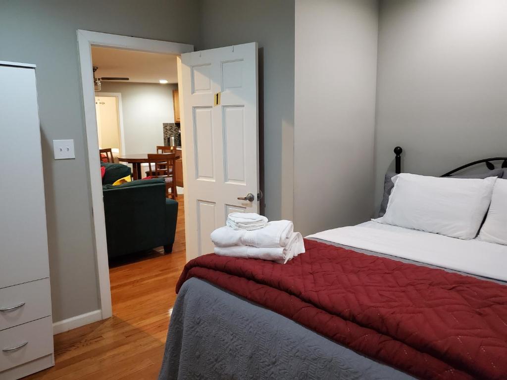 a bedroom with a bed with towels on it at Cozy Retreat on Atlantic Ave in Brooklyn