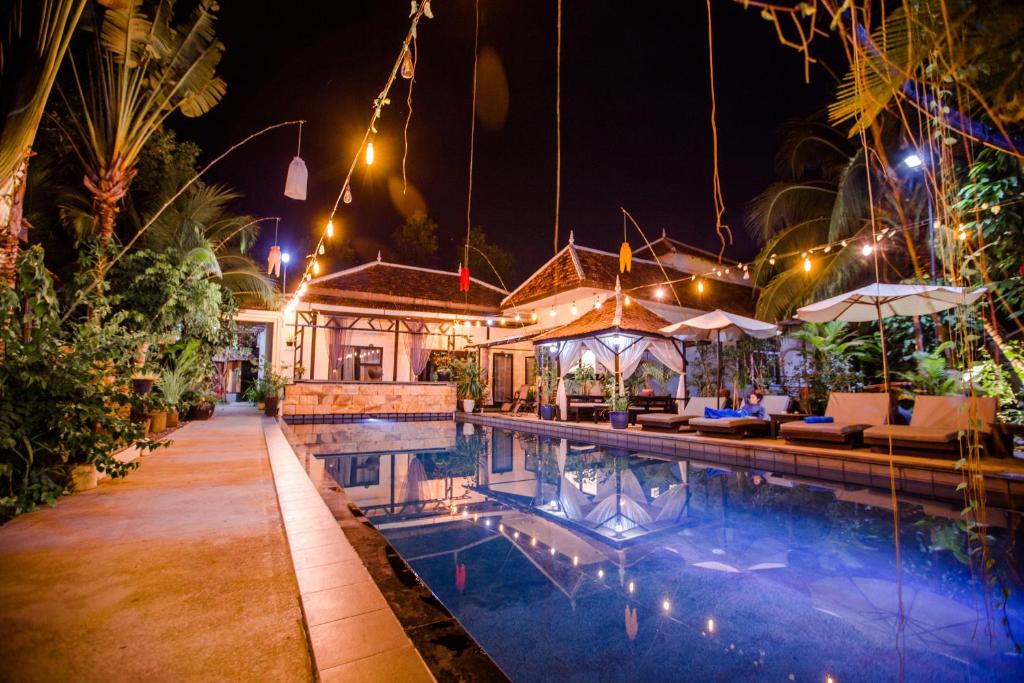 a hotel room with a large pool of water at The Sanctuary Villa Battambang in Battambang