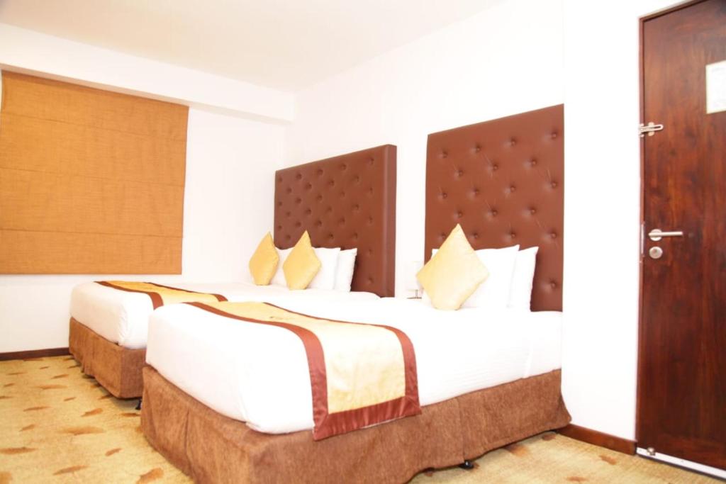 Postel nebo postele na pokoji v ubytování City Hotel Colombo 02