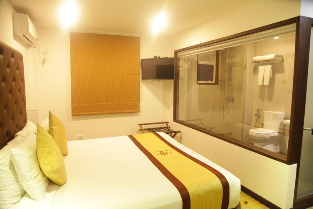 Postel nebo postele na pokoji v ubytování City Hotel Colombo 02