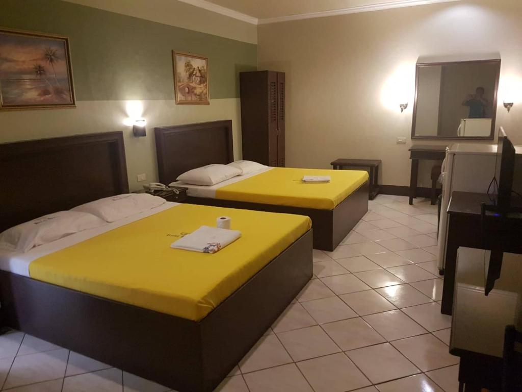 Postel nebo postele na pokoji v ubytování ROLET HOTEL