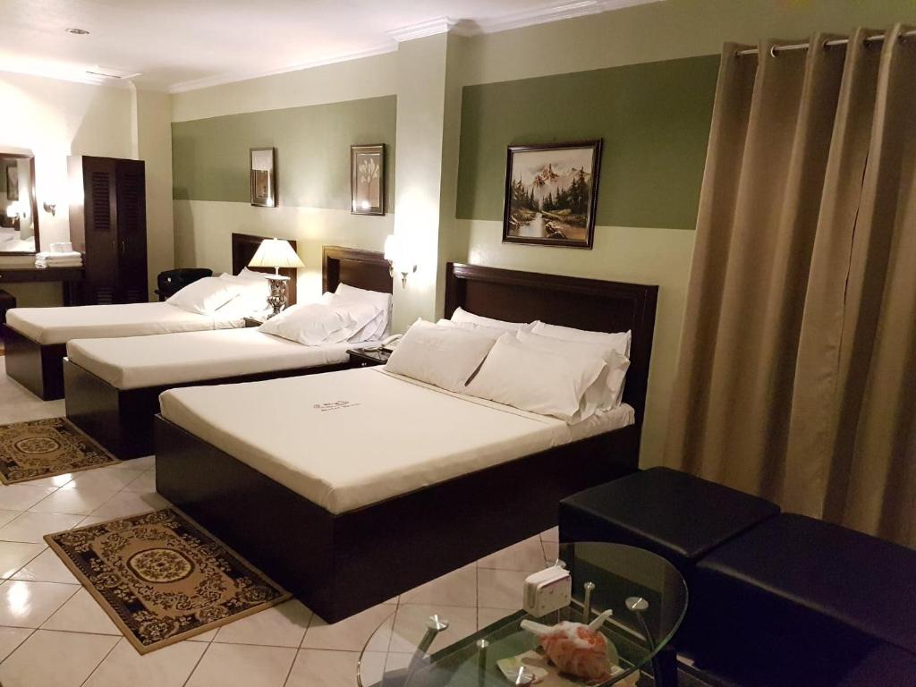 Postel nebo postele na pokoji v ubytování ROLET HOTEL