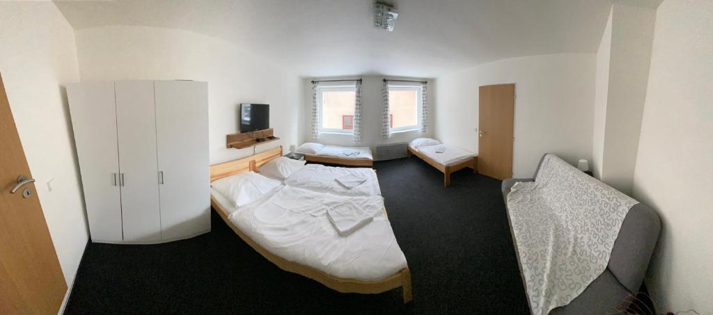 Postel nebo postele na pokoji v ubytování Apartmány Viktorka